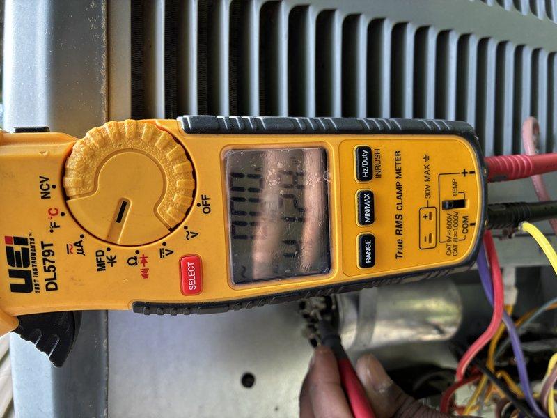 Completed MVP preventive maintenance visit on 7-year-old cooling system. Performed comprehensive system inspection including electrical testing with clamp meter to verify proper amperage draw and voltage levels at unit. Inspected and tested disconnect fuse assembly, noting moderate oxidation and corrosion on copper contacts and fuse holders consistent with outdoor exposure and system age. Verified both fuses intact and operational. Checked condenser coil condition, electrical connections, and overall system performance. All critical components tested and found functional. System operating within normal parameters for unit age.