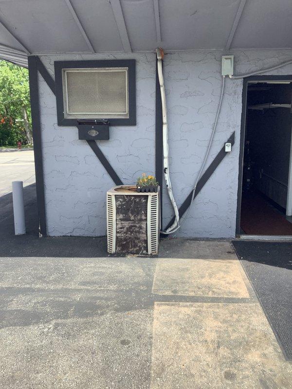 Completed comprehensive HVAC system replacement estimate for aging residential system. Assessed existing outdoor condenser unit showing significant wear and weathering, along with indoor furnace and ventilation components in basement utility area. Documented current equipment condition and specifications to provide complete system replacement proposal.