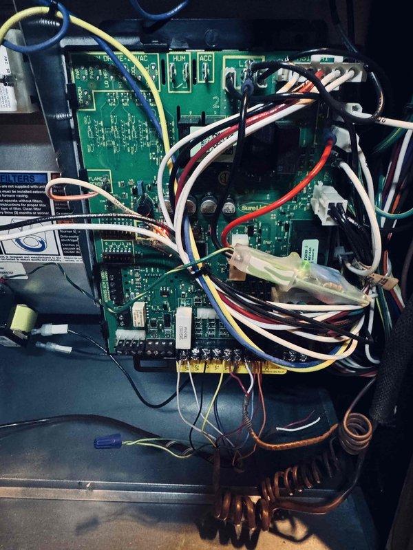 Completed preventive maintenance inspection on air conditioning system control board and electrical components. Documented condition of PCB with integrated circuits, sensors, LED display indicators, and wire harness connections. All electronic components, terminals, and copper coil inductors found in proper working order with no visible signs of wear or damage requiring immediate attention.