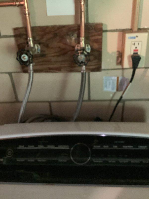 Replaced hot and cold shut-off valves in garage, installed new laundry room faucet, and replaced boiler drains. Work included mounting new copper supply lines with ball valves on backing boards and connecting flexible supply hoses to appliances. Job involved Jack and Jill sink configuration with notation that drywall access in closet behind sinks may be required for drain cable routing if blockage extends between traps.