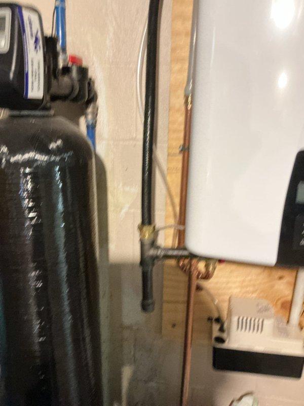 Completed installation of tankless water heater system in utility room, replacing existing conventional water heating unit. All necessary parts and navigation/recirculation kit were pre-staged and installed, including proper venting, copper supply line connections, and gas line hookup per manufacturer specifications. System was tested, commissioned, and confirmed operational with all safety checks performed.