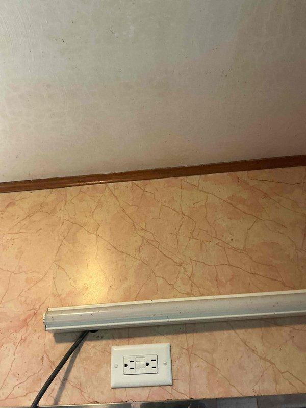 Responded to service call for non-functional bathroom lighting. Upon inspection, identified wiring issues at the electrical panel and traced circuit to affected bathroom fixtures. Corrected improper connections at the panel, verified proper circuit protection, and restored power to bathroom lighting circuit. Tested all fixtures to confirm proper operation and ensured all connections met current electrical code requirements.