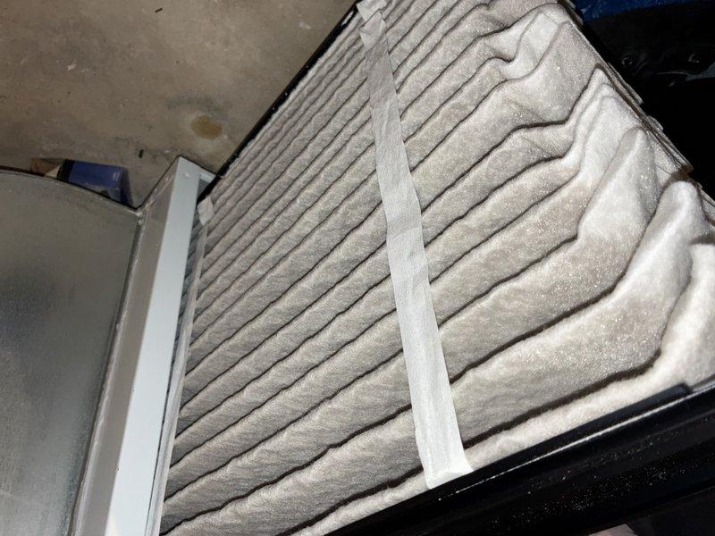 Completed scheduled MVP cooling maintenance visit on 15-year-old system. Upon inspection, discovered heavily soiled air filter with significant dust accumulation throughout pleated media, restricting airflow. Identified severe frost buildup on evaporator coil assembly, indicating potential refrigerant flow restriction or low charge condition. Observed rusted support bracket within unit, consistent with system age. Replaced dirty air filter to restore proper airflow. Addressed evaporator coil icing issue and verified system operation. Unit returned to normal cooling function upon completion of service.