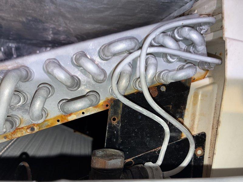 Completed scheduled MVP cooling maintenance visit on 15-year-old system. Upon inspection, discovered heavily soiled air filter with significant dust accumulation throughout pleated media, restricting airflow. Identified severe frost buildup on evaporator coil assembly, indicating potential refrigerant flow restriction or low charge condition. Observed rusted support bracket within unit, consistent with system age. Replaced dirty air filter to restore proper airflow. Addressed evaporator coil icing issue and verified system operation. Unit returned to normal cooling function upon completion of service.