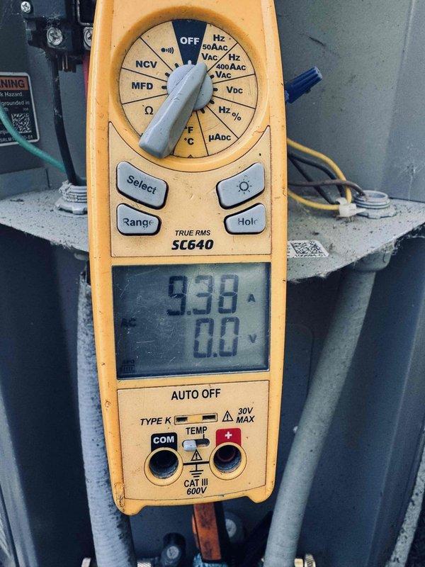 Completed MVP recurring maintenance visit on 5-year-old cooling system. Performed electrical diagnostics using digital multimeter, measuring amperage at 9.38A and voltage readings on contactor assembly. Inspected all electrical connections, contactor operation, and wiring integrity within control panel, confirming all components operating within normal parameters.