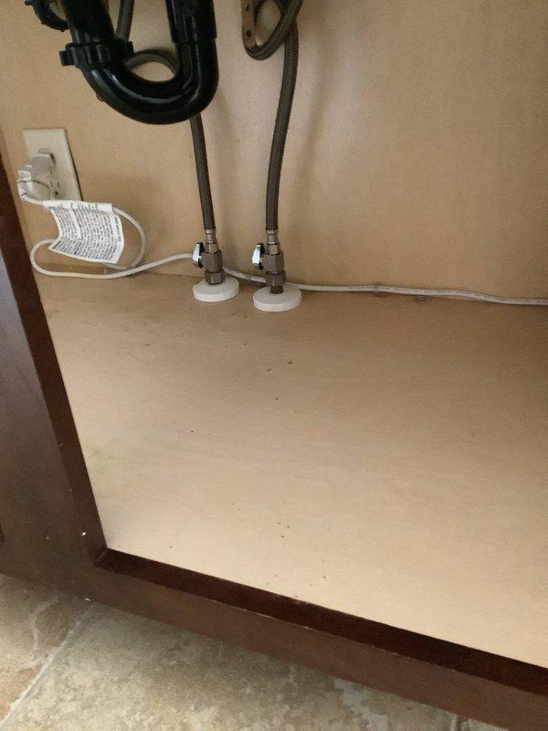 Replaced defective shutoff valves under the bathroom faucet and completed repairs to the widespread faucet assembly. New shutoff valves were installed on the supply lines to restore proper water flow control and eliminate leaks at the fixture connections.