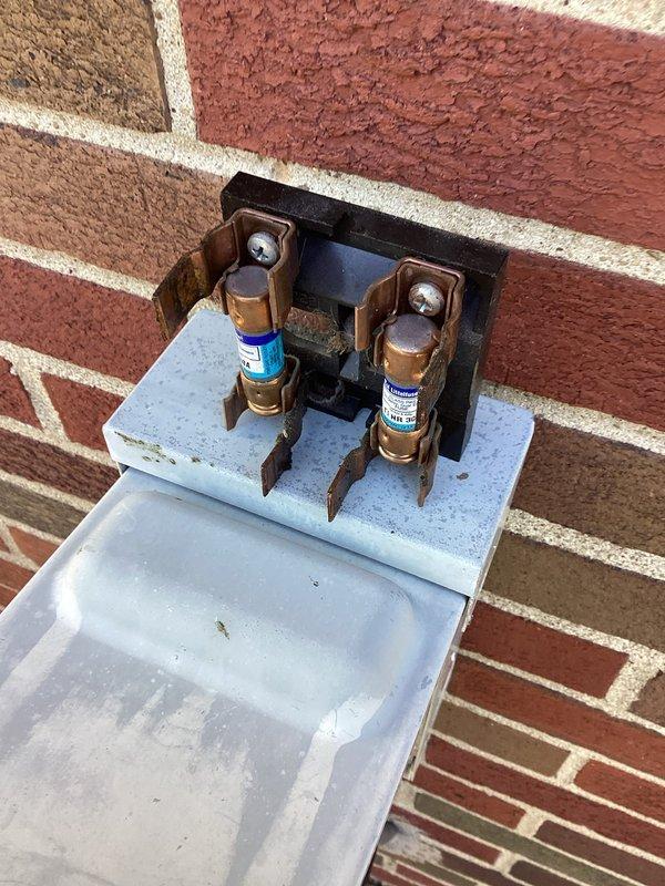Completed comprehensive air conditioning maintenance inspection per MVP member benefits program. Performed visual assessment of refrigerant line set, noting copper pipe condition and connection integrity at service valve. Inspected electrical disconnect switch and verified proper fuse installation and secure mounting. System components examined and documented photographically for maintenance records.