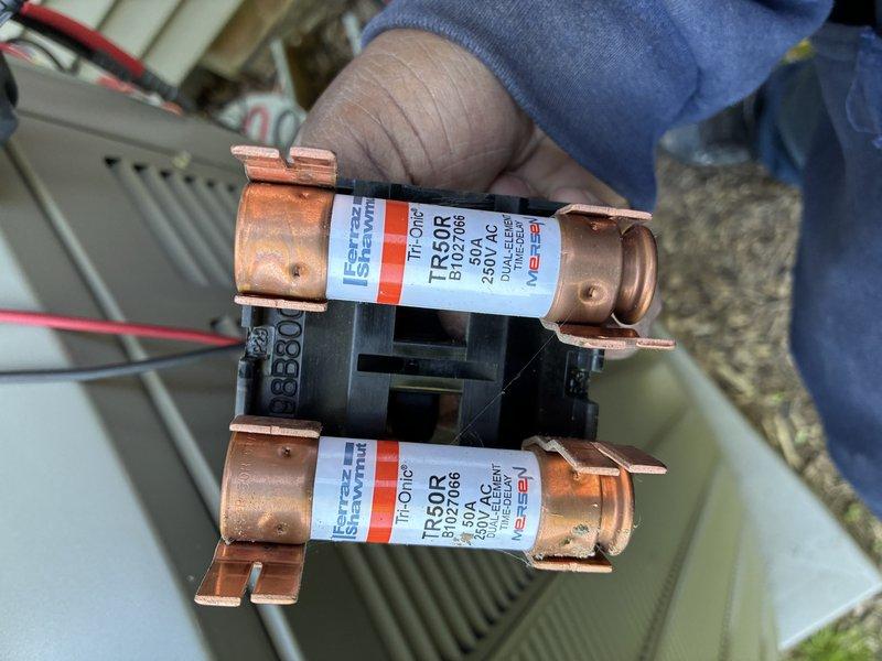 Completed scheduled MVP cooling maintenance visit on 3-year-old system. Inspected and tested electrical components, including amperage draw measurements using clamp meter to verify proper compressor and fan motor operation. Identified and replaced two 50-amp time-delay fuses (Ferraz Shawmut TR50R, 600V AC rated) in the disconnect box that showed signs of oxidation and wear. System tested and confirmed operating within normal parameters following fuse replacement.