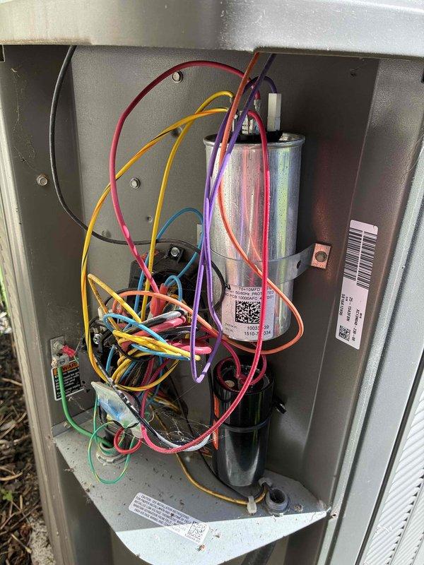 Completed MVP cooling visit on residential outdoor condensing unit. Performed visual inspection of exterior cabinet, verified proper clearance around unit, and checked condenser coil fins for debris accumulation. Accessed electrical compartment to inspect capacitor, contactor, and associated wiring connections. All electrical components showed proper terminations with no signs of overheating or damage. Unit operating within normal parameters at time of service.