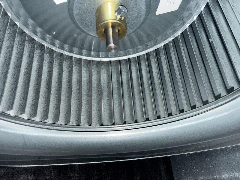 Completed MVP cooling maintenance visit on 16-year-old HVAC system. Inspected blower wheel assembly and evaporator coil, documenting normal dust accumulation on blower blades and dark discoloration with debris buildup on evaporator fins. Unit operational with age-appropriate wear patterns observed throughout components.