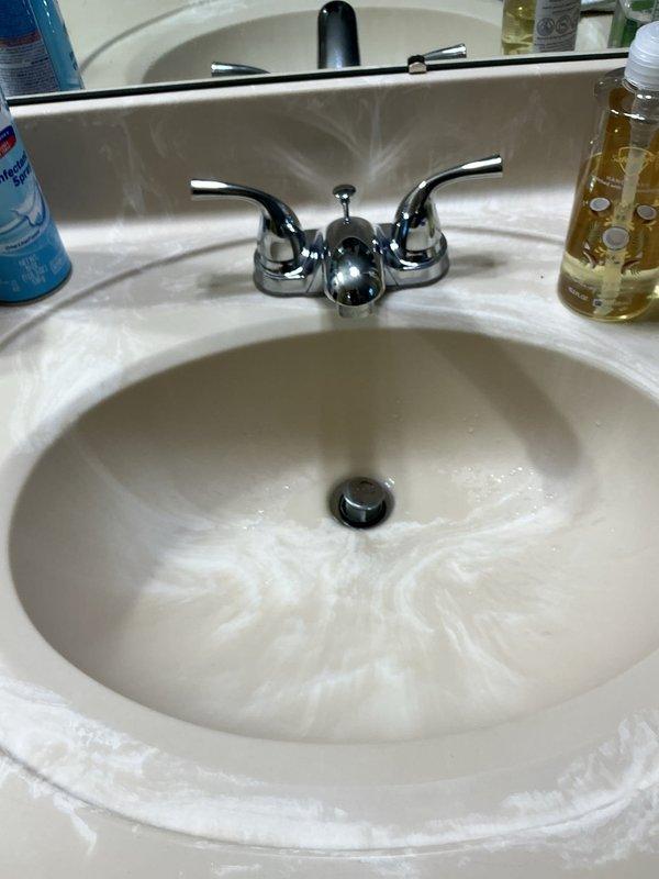 Completed comprehensive plumbing fixture replacement throughout the residence. Installed new chrome dual-handle lavatory faucet in first floor bathroom with proper water supply connections and drain assembly. Replaced kitchen faucet with stainless steel single-handle unit including integrated spray attachment, mounted on double-basin stainless steel sink with updated deck plate configuration. Installed two matching chrome dual-handle lavatory faucets in master bathroom, ensuring proper hot and cold water supply connections and drain linkages. Replaced existing sump pump system in basement with new unit and installed fresh check valve to prevent backflow and ensure proper discharge operation. Removed and replaced exterior garage sillcock with frost-proof model, verifying proper pitch for drainage and secure mounting to exterior wall. All fixtures tested for proper operation, water pressure, and leak-free connections upon completion.