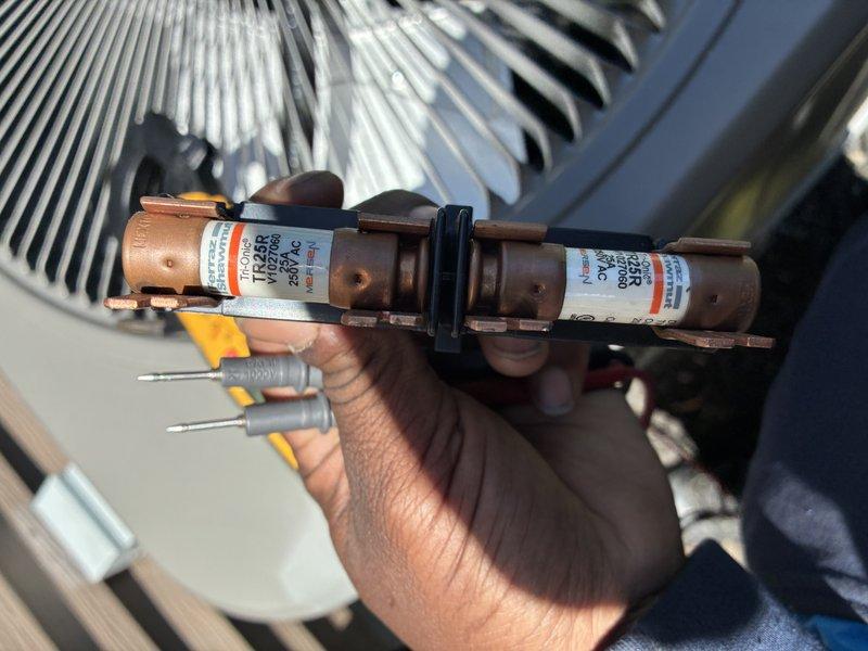 Completed MVP cooling maintenance visit on 4-year-old HVAC system. Inspected and tested electrical components, including 250V AC fuses rated at TF600K. Measured system amperage at 213.3 amps using clamp meter to verify proper electrical draw and compressor performance. Verified condenser unit operation and inspected finned coil for proper heat transfer. All electrical connections tested and found secure. System operating within normal parameters.