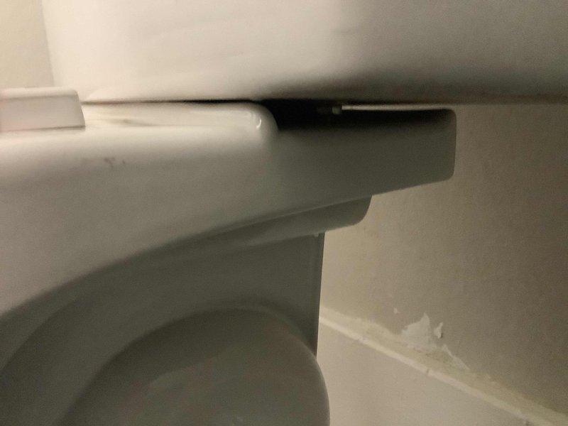 Responded to service call for leaking toilet tank in historic residential property with updated plumbing systems. Upon inspection, identified water dripping from tank assembly on standard two-piece white porcelain toilet fixture. Diagnosed faulty tank-to-bowl connection gasket and deteriorated tank bolts causing visible water seepage. Shut off water supply at fixture stop valve and drained tank completely. Removed existing hardware and replaced worn rubber gasket, tank bolts, and washers with new components. Ensured proper alignment of tank to bowl during reassembly and torqued mounting bolts to manufacturer specifications to prevent over-tightening and potential porcelain damage. Restored water supply and conducted multiple flush cycles to verify leak elimination and proper tank refill operation. Inspected surrounding areas for water damage and confirmed no additional issues with bowl seal or supply line connections. Fixture restored to full working condition with no further leakage d
