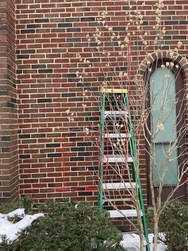 Completed installation of a 1-to-1 mini split system on brick exterior structure. Installed outdoor condenser unit using extension ladder for elevated mounting, ran refrigerant lines and electrical connections to interior air handler, and integrated electrical disconnect into existing breaker panel with proper circuit protection.