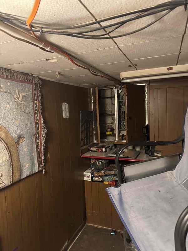 Responded to service call for non-functioning electrical circuit serving garage. Performed diagnostic assessment of electrical system including inspection of interior switch controls, main panel neutral connections, and garage sub-panel. Traced circuit routing through basement utility area to identify potential points of failure. Documented existing wiring configuration and overhead cable routing for further evaluation and repair recommendations.