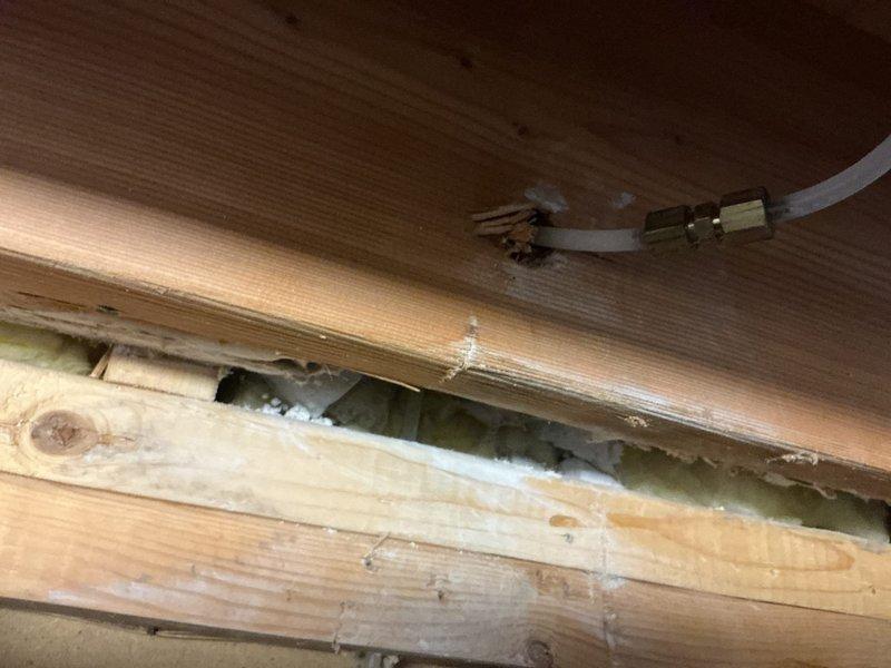 Responded to emergency service call for broken copper water line in kitchen ceiling. Upon arrival, confirmed copper pipe failure within ceiling cavity requiring immediate repair. Shut off water supply to affected area to prevent further water damage. Accessed damaged section through existing ceiling opening. Cut out failed copper line section and installed new copper piping using proper soldering techniques and fittings. Pressure tested repair to ensure no leaks. Verified water flow restoration to kitchen fixtures. Left ceiling access open as requested for customer's contractor to complete drywall repairs.