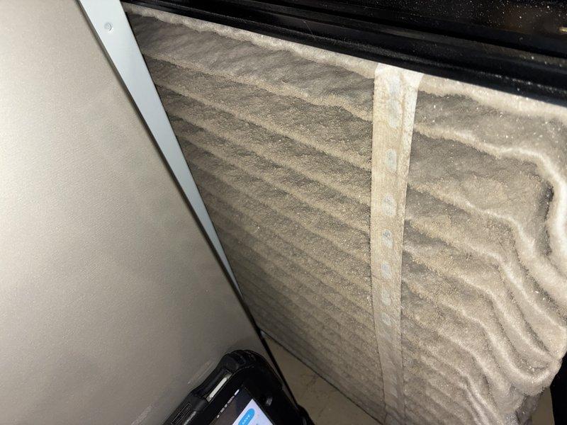 Completed scheduled air conditioning maintenance visit. Performed comprehensive system inspection including filter assessment and control board evaluation. Air filter showed moderate dust accumulation and discoloration, indicating normal usage patterns. Inspected electronic control panel and dual circuit boards, verifying all electrical connections, wire harnesses, and component integrity. All safety warning labels present and legible. System operational and functioning within normal parameters.