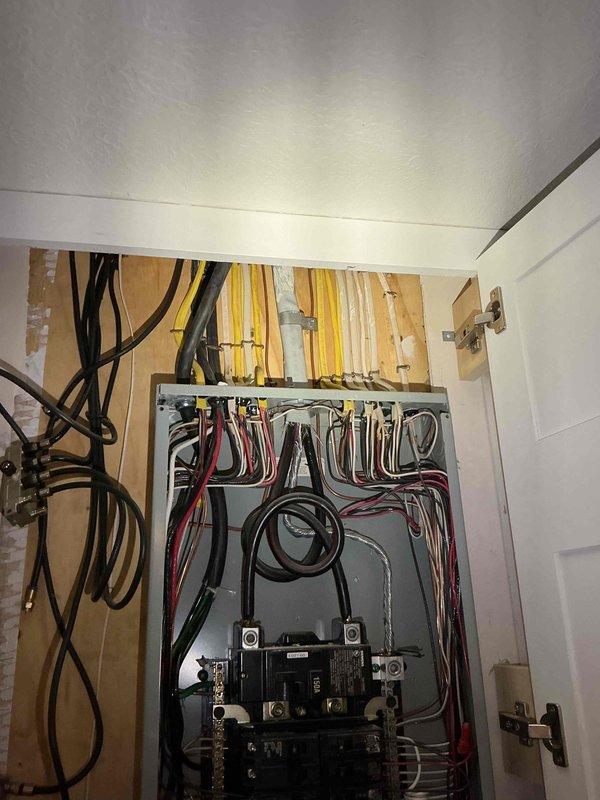 Performed electrical panel inspection and provided quote for removal of abandoned hot tub circuit wiring. Documented existing panel configuration showing main 150A breaker with organized branch circuits, multiple breaker panels, and identified disconnected wiring that previously served hot tub requiring removal from system.