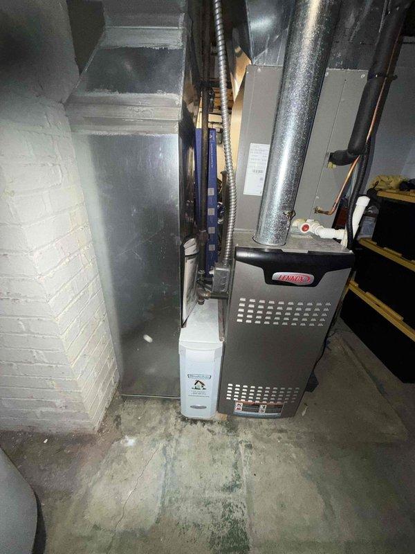 Completed preventive maintenance visit on Bryant HVAC system for MVP customer. Performed inspection of blower wheel assembly, which showed dust accumulation on central hub but otherwise clean blade surfaces, and verified proper operation of furnace and air handler components in basement mechanical room.