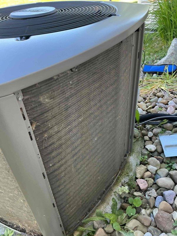 Completed comprehensive MVP cooling maintenance visit on 10-year-old air conditioning system. Performed visual inspection of outdoor condenser unit, noting heavy accumulation of dirt, dust, and debris on exterior coil fins requiring attention. Conducted electrical diagnostics using clamp meter to verify system performance, measuring capacitance and amperage readings within the control panel to ensure proper component operation and electrical integrity of the unit.