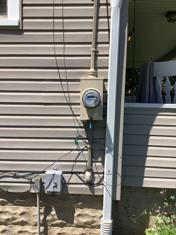 Installed 6/3 AWG aluminum conductor circuit for air conditioning unit, running from main electrical panel through basement ceiling joists to exterior meter location. Secured all conduit and wiring per NEC requirements, utilizing proper supports and fasteners throughout the installation path. Completed exterior meter connections with weatherproof fittings and verified proper grounding at all termination points.