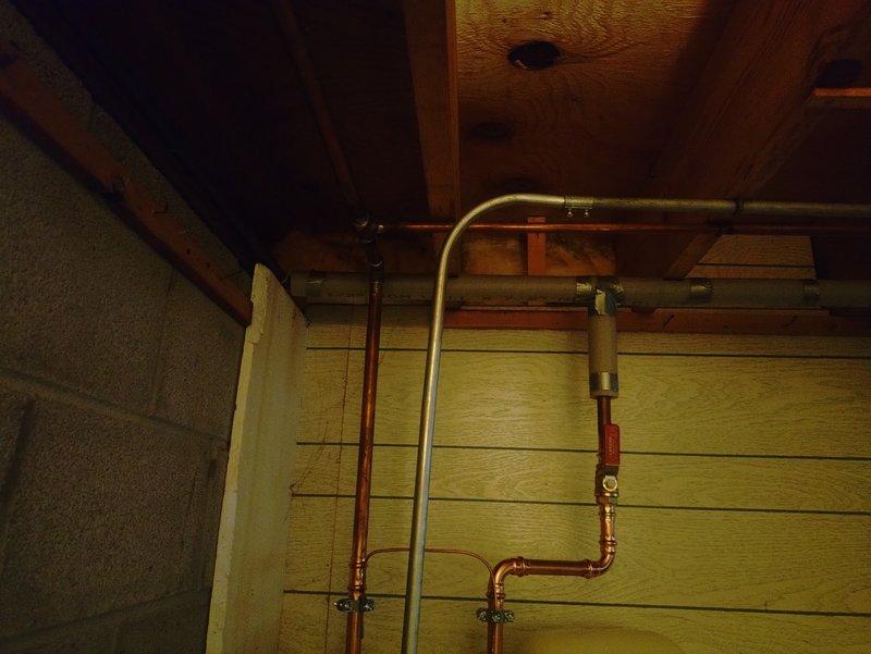 Replaced 50-gallon residential water heater in basement utility area. Installed new unit with complete water heater kit, configured copper supply and discharge piping with proper connections and fittings, and insulated hot water lines to prevent heat loss. All plumbing connections tested and verified operational upon completion.