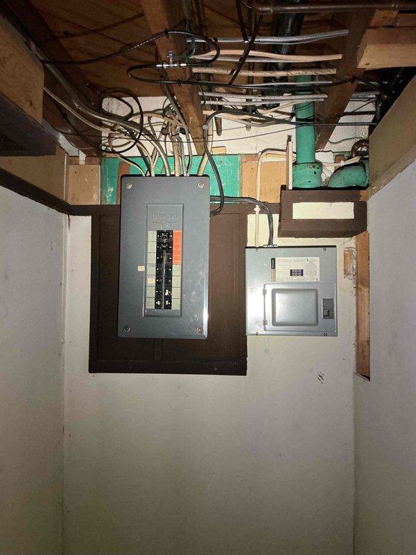 Responded to customer concern regarding sparking at light bulb socket when wall switch is activated. Inspected electrical panel and branch circuit wiring in basement mechanical room. Verified proper circuit breaker operation and panel connections. Examined wall switch and receptacle combination with wooden cover plate. Identified loose connection at socket terminal causing arcing condition. Tightened all terminal connections, verified proper grounding, and tested switch operation under load to confirm sparking issue was resolved and circuit functioning safely.