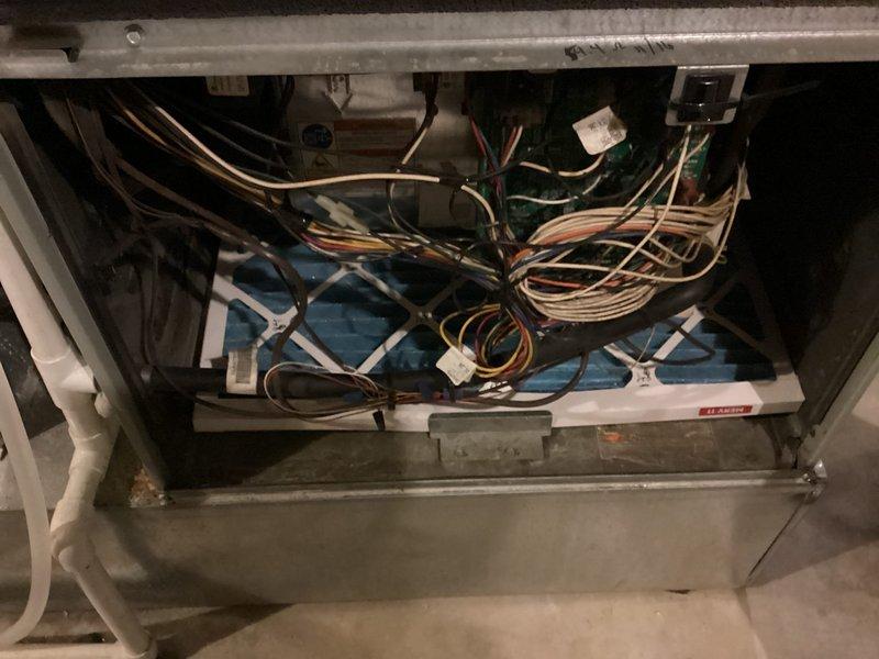 Completed routine MVP cooling maintenance visit on HVAC system. Inspected electrical components, wiring connections, and refrigerant lines within the air handler compartment, confirming all connections were secure and operational. Examined condensate drain valve and associated plumbing, noting mineral deposits and corrosion present on brass fittings consistent with normal system age and water exposure.