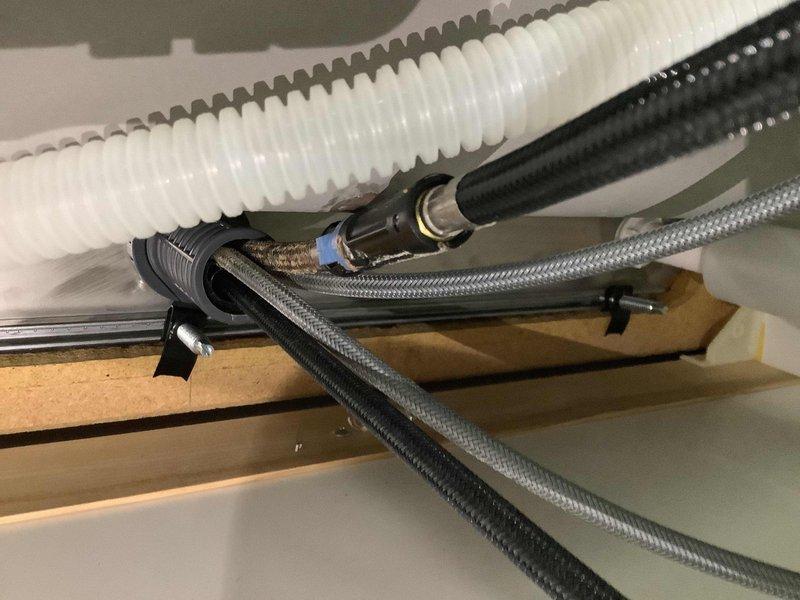 Responded to service call for low water pressure affecting kitchen sink and basement fixtures. Upon arrival, conducted diagnostic assessment of the plumbing system to identify the source of pressure loss. Inspected supply lines, shut-off valves, and fixture connections in both affected areas. Examined visible piping infrastructure including main water supply lines and branch connections serving the kitchen and basement zones. Checked for potential obstructions, valve restrictions, and sediment buildup that could impede water flow. Evaluated the condition of aerators and fixture components that may contribute to reduced pressure. Documented existing plumbing configuration with photographic evidence showing supply line routing and fixture installations. Also assessed basement sink location and provided consultation regarding feasibility of lowering the sink installation for improved functionality and accessibility.