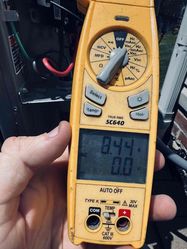 Performed routine maintenance on a one-year-old air conditioning system. Conducted electrical diagnostics using a digital multimeter to verify proper voltage and capacitance readings at the outdoor condensing unit. All measurements were within manufacturer specifications, indicating the system is operating efficiently with no electrical issues detected at this time.