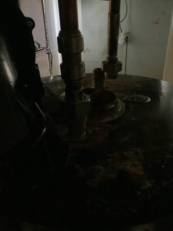 Conducted on-site assessment of existing A.O. Smith power vent tanked water heater located in basement utility area. Evaluated current unit's condition, including examination of the black power vent blower assembly mounted on top of the tank, connected copper and PVC piping configurations, and overall system integrity. Documented the installation with photographs showing the stainless steel tank, venting components, and plumbing connections to facilitate accurate replacement specifications. Prepared comprehensive estimate for new power vent water heater replacement, accounting for proper venting requirements and existing plumbing infrastructure compatibility.