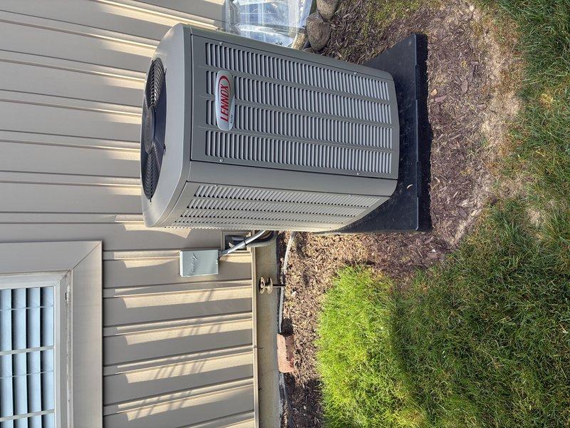 Performed routine maintenance on a two-year-old Lennox air conditioning system. Replaced air filter, inspected evaporator coil and heat exchanger assembly, verified refrigerant lines and connections were secure, and confirmed outdoor condenser unit was operating properly with no visible defects or airflow obstructions.