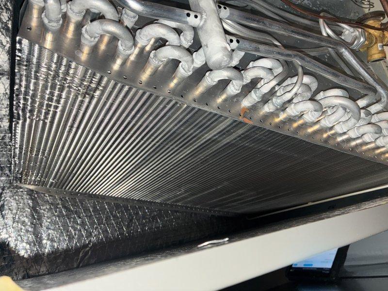 Performed routine maintenance on a two-year-old Lennox air conditioning system. Replaced air filter, inspected evaporator coil and heat exchanger assembly, verified refrigerant lines and connections were secure, and confirmed outdoor condenser unit was operating properly with no visible defects or airflow obstructions.