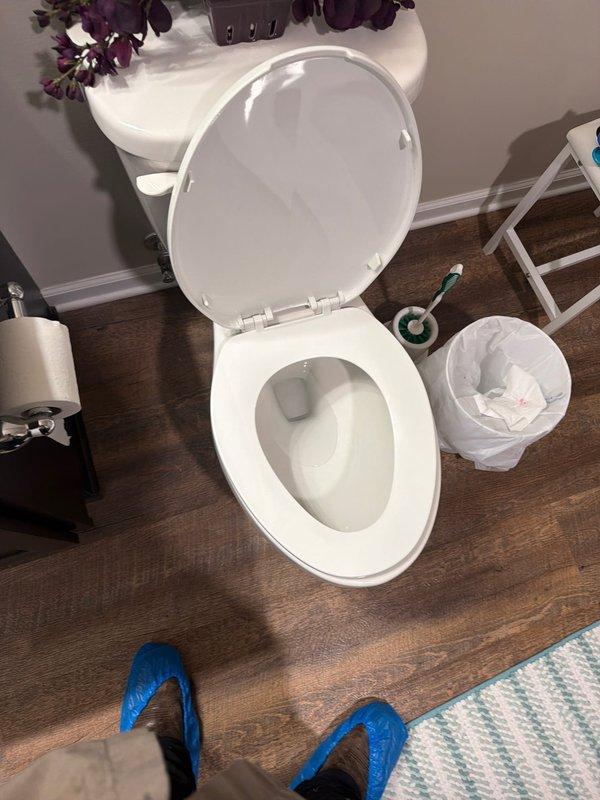 Removed existing standard-height toilet and installed new comfort height toilet unit supplied by service company. Disconnected water supply line from shut-off valve, drained remaining water from tank and bowl, and removed old toilet by unbolting from floor flange. Inspected flange for damage and ensured proper seal condition. Positioned new wax ring on flange, carefully set comfort height toilet in place, and secured with new closet bolts. Reconnected water supply line to fill valve, turned on water supply, and tested for leaks at all connection points. Verified proper flush operation, bowl refill function, and tank fill cycle. Cleaned work area and confirmed toilet was level and stable upon completion.