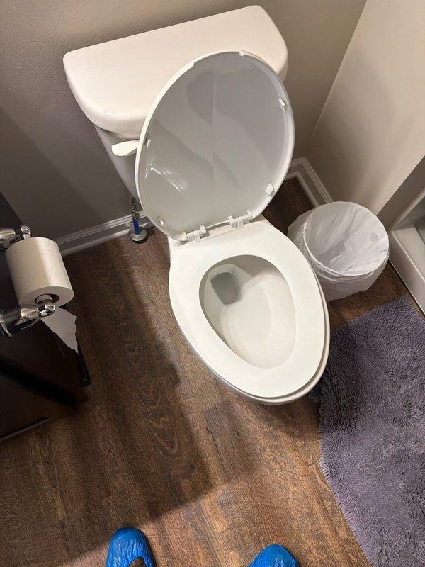 Removed existing standard-height toilet and installed new comfort height toilet unit supplied by service company. Disconnected water supply line from shut-off valve, drained remaining water from tank and bowl, and removed old toilet by unbolting from floor flange. Inspected flange for damage and ensured proper seal condition. Positioned new wax ring on flange, carefully set comfort height toilet in place, and secured with new closet bolts. Reconnected water supply line to fill valve, turned on water supply, and tested for leaks at all connection points. Verified proper flush operation, bowl refill function, and tank fill cycle. Cleaned work area and confirmed toilet was level and stable upon completion.