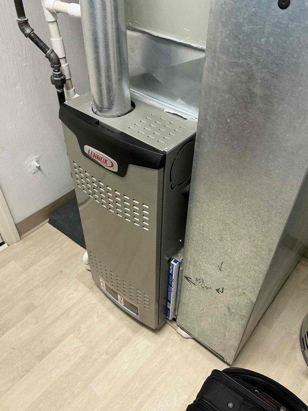 Conducted on-site assessment for HVAC system replacement, evaluating existing Lennox furnace installation and associated ductwork in residential utility space. Documented current equipment configuration, including air distribution plenum and PVC condensate drainage system, and provided comprehensive replacement estimate with limited right of rescission terms.