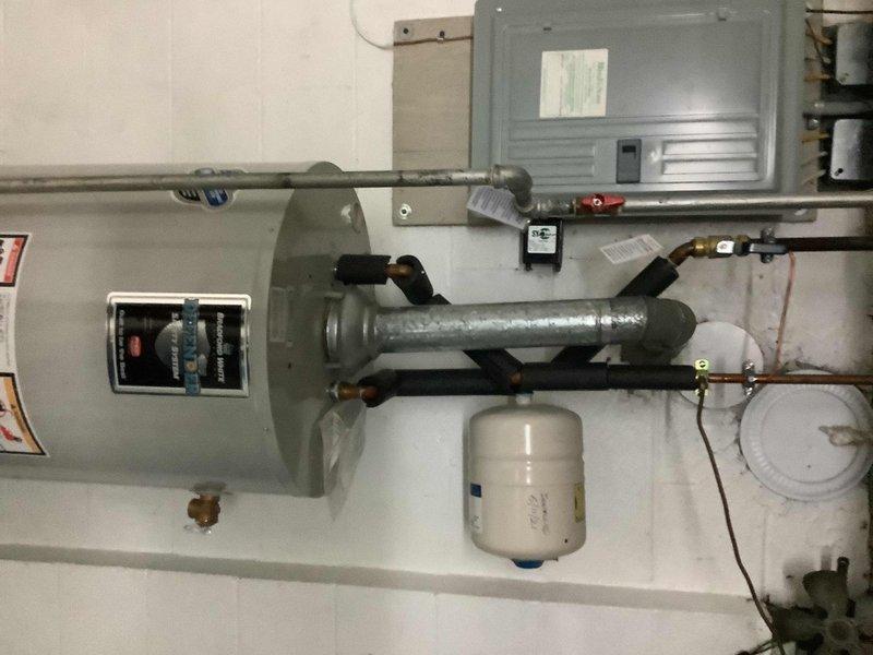 Responded to service call for 7-year-old natural gas tanked water heater with pilot light that would not remain lit. Upon inspection, found thermocouple assembly showing signs of corrosion and deterioration, along with significant rust buildup on internal components and burner chamber. Tested gas flow and pilot assembly operation, confirming thermocouple failure preventing proper flame sensing. Replaced defective thermocouple, cleaned pilot orifice and burner assembly, and removed rust deposits from internal brackets and housing. Verified proper pilot ignition, flame characteristics, and main burner operation. Unit tested and confirmed operational with pilot remaining lit and water heater cycling properly.