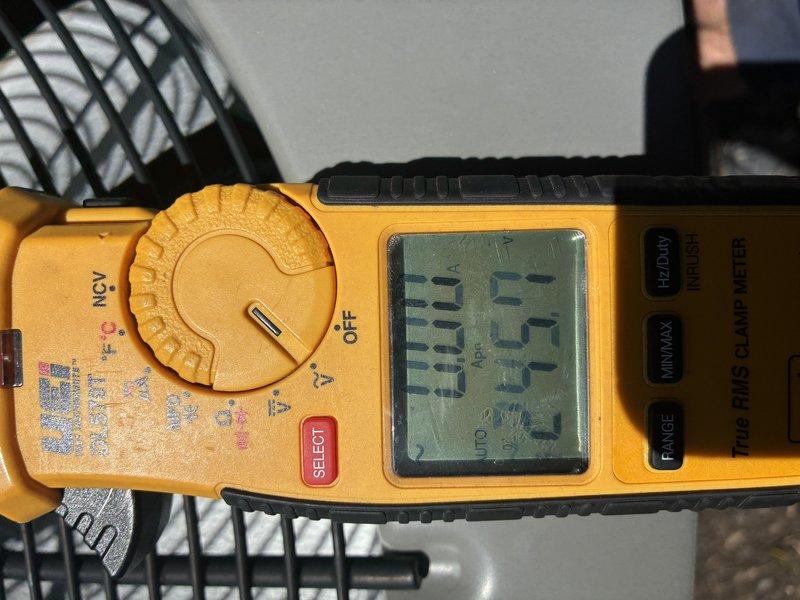 Completed routine MVP cooling maintenance visit on air conditioning system. Performed electrical diagnostics using clamp meter, recording voltage and amperage readings to verify proper system operation. Inspected exterior ventilation louvers and air intake components, confirming adequate airflow and structural integrity of all accessible equipment.