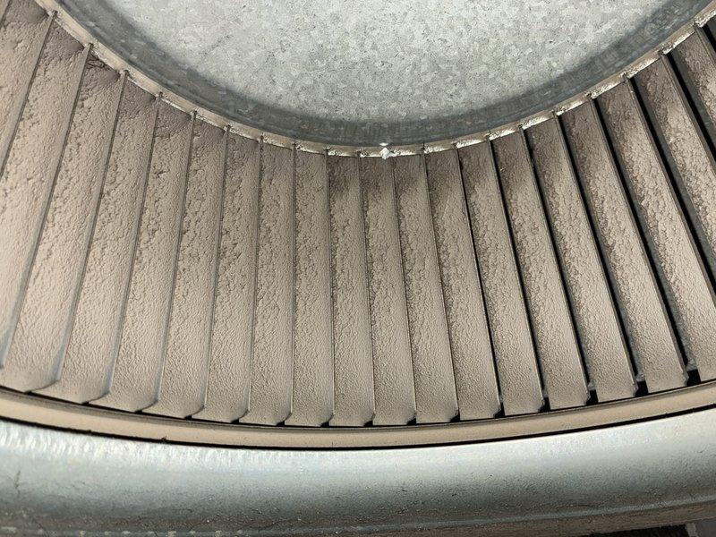 Completed MVP cooling maintenance visit on 22-year-old air conditioning system. Performed standard maintenance procedures including inspection of blower wheel assembly, which showed dust and debris accumulation on blades typical of seasonal operation. Observed significant rust and corrosion on overhead plumbing infrastructure associated with the system, indicating advanced age and environmental exposure consistent with the unit's service life. All routine maintenance tasks completed per MVP service protocol.