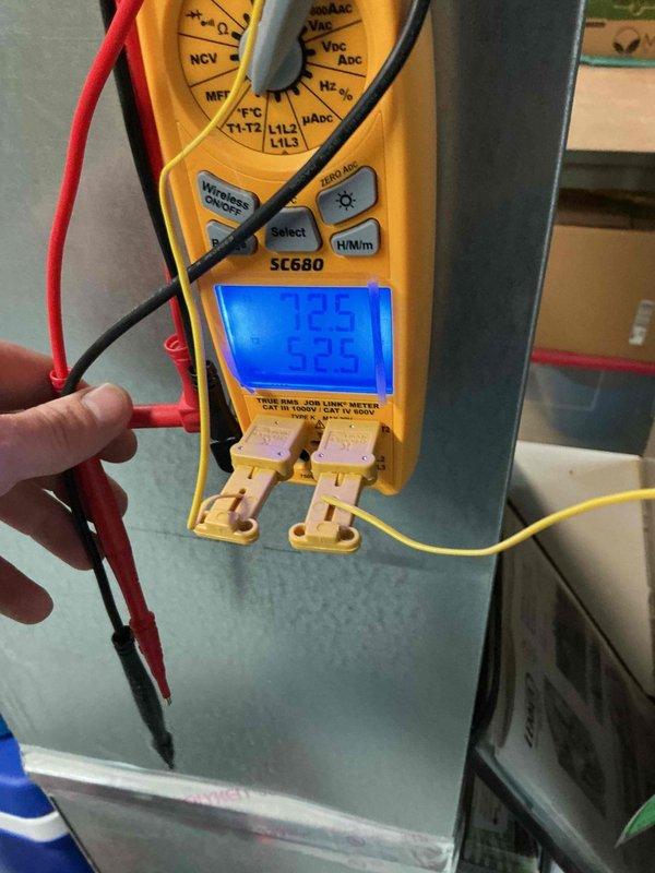 Completed preventive maintenance cooling visit on 5-year-old residential air conditioning system. Performed comprehensive inspection of outdoor condensing unit, verified electrical readings with multimeter showing 122.5V supply voltage and 53.5 MFD capacitance within acceptable range, and documented equipment condition with service photos. Unit operating properly with normal parameters confirmed.