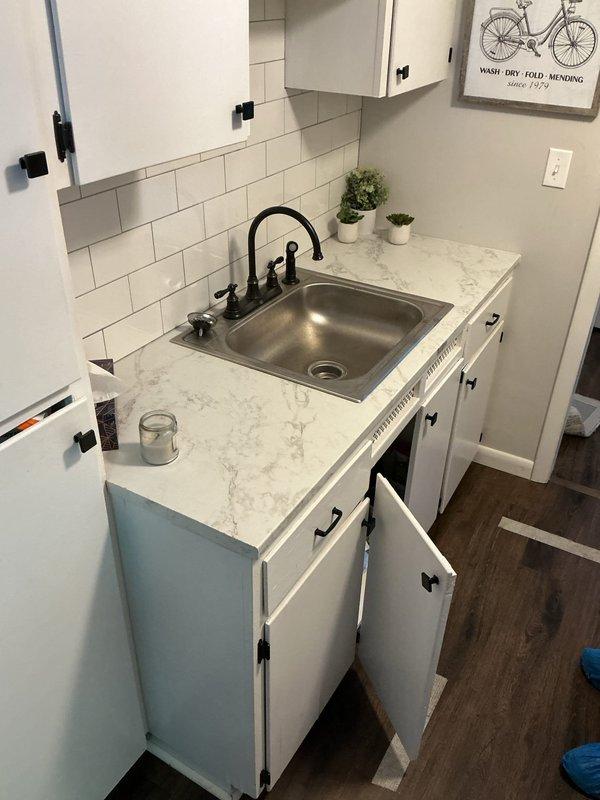 Responded to recurring basement bathroom drainage issues with water backing up into shower from upstairs usage and toilet bubbling/fluctuating water levels. Performed main drain line cleaning to clear partial sewer blockage and conducted camera inspection to identify underlying cause of repeated obstructions. Restored proper drainage flow throughout plumbing system.