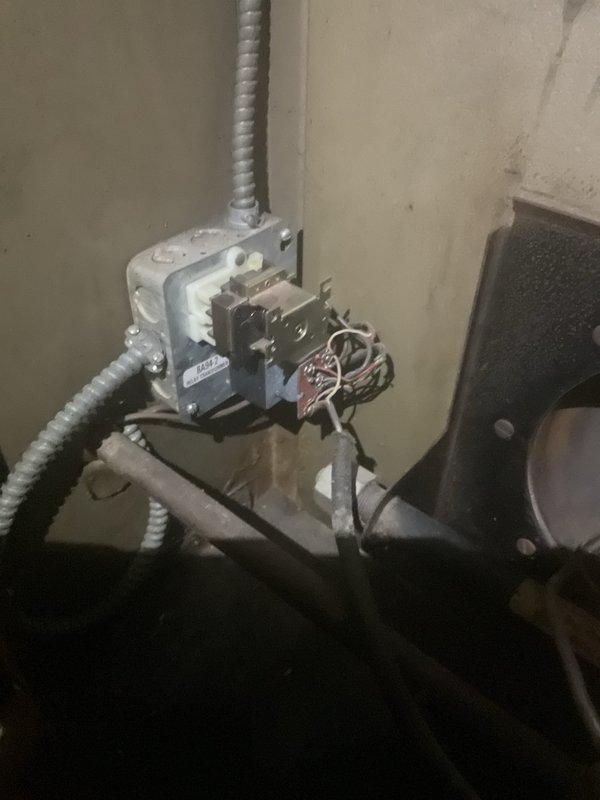 Provided second opinion evaluation on 40-year-old furnace system requiring transformer and limit switch replacement. Inspected electrical control components and furnace access areas, documented existing conditions with photos showing control box wiring and internal furnace components. Confirmed diagnosis and reviewed repair scope with customer who had received prior estimate from competitor.