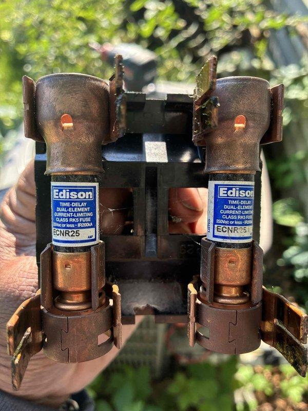 Completed scheduled MVP cooling maintenance visit on 8-year-old system. Upon inspection, discovered heavy frost and ice buildup on evaporator coil fins, indicating restricted airflow or potential refrigerant issue. Identified failed dual-element time-delay fuses (ECNR25) showing significant corrosion and oxidation from outdoor exposure. Replaced defective fuses and addressed underlying cause of ice formation to restore proper system operation.