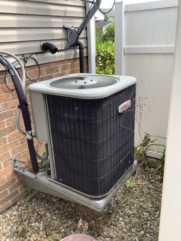 Responded to no cooling complaint with indoor temperature at 78°F despite thermostat set to 69°F. Inspected Lennox outdoor condenser unit and electrical connections, documented system condition with photos showing unit placement and terminal block wiring configuration. Performed diagnostic evaluation to identify cause of cooling failure and restore proper system operation.
