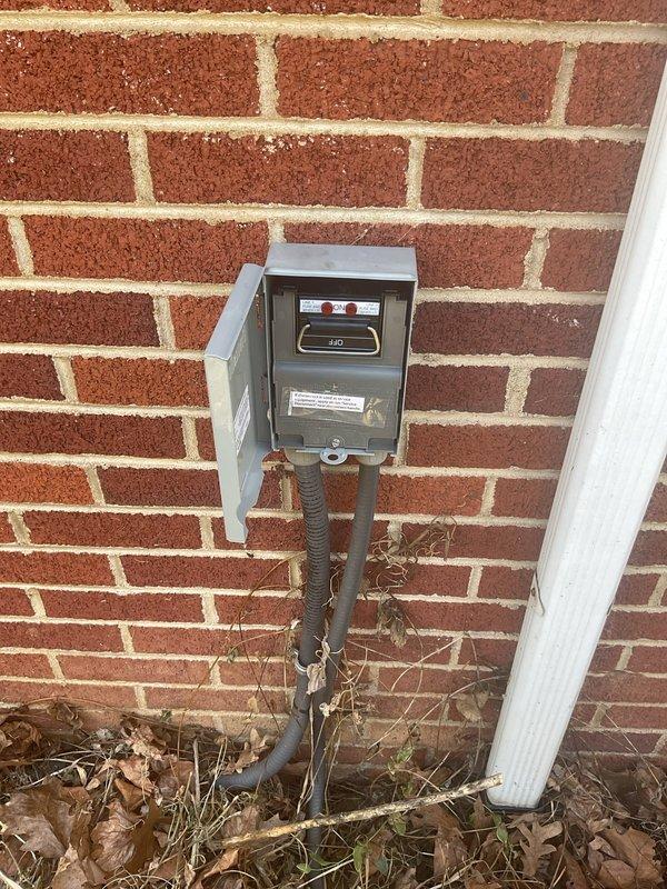 Replaced outdoor electrical service disconnect for HVAC system. Removed existing weathered disconnect switch mounted on exterior brick wall and installed new unit with proper conduit connections. All electrical connections verified and system tested for proper operation.
