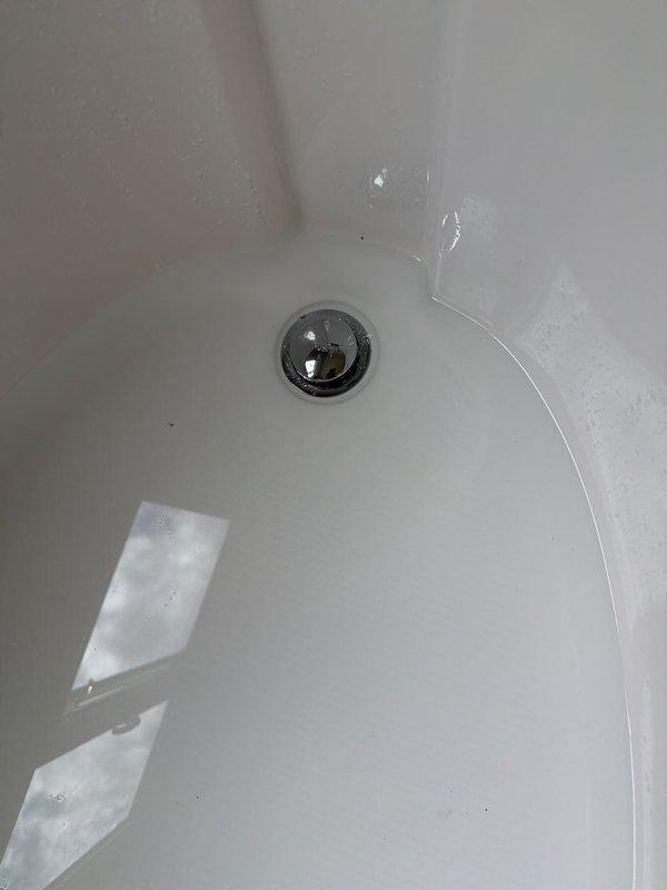 Successfully installed a new toe touch drain mechanism into the existing bathtub waste and overflow assembly. The replacement chrome-plated drain cover was properly secured and tested for proper operation, restoring full functionality to the tub drainage system.