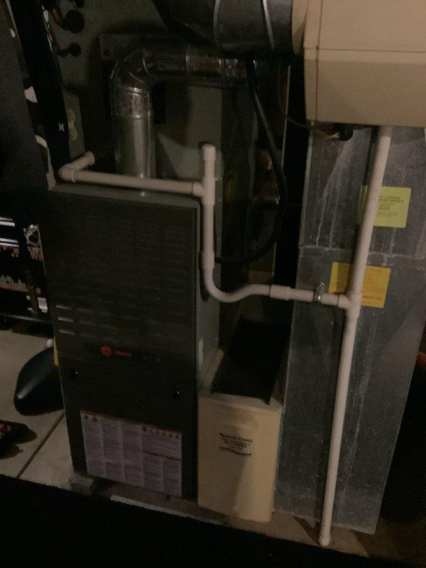 Responded to no cooling call on 10-year-old residential HVAC system with reported condenser malfunction and unusual noise. Upon arrival, inspected outdoor condensing unit and indoor air handler system. Documented equipment condition and configuration, including furnace, evaporator coil unit, and outdoor condenser positioned on concrete pad. Customer enrolled in maintenance program during service visit.