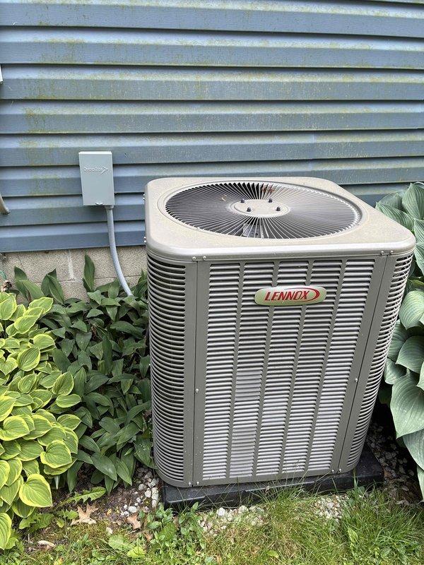 Completed routine cooling maintenance on Lennox air conditioning system. Inspected outdoor condensing unit, verified electrical connections at capacitor and blower motor assembly, and confirmed all wiring terminations were secure with proper color-coded connections intact. System operational and ready for continued service.