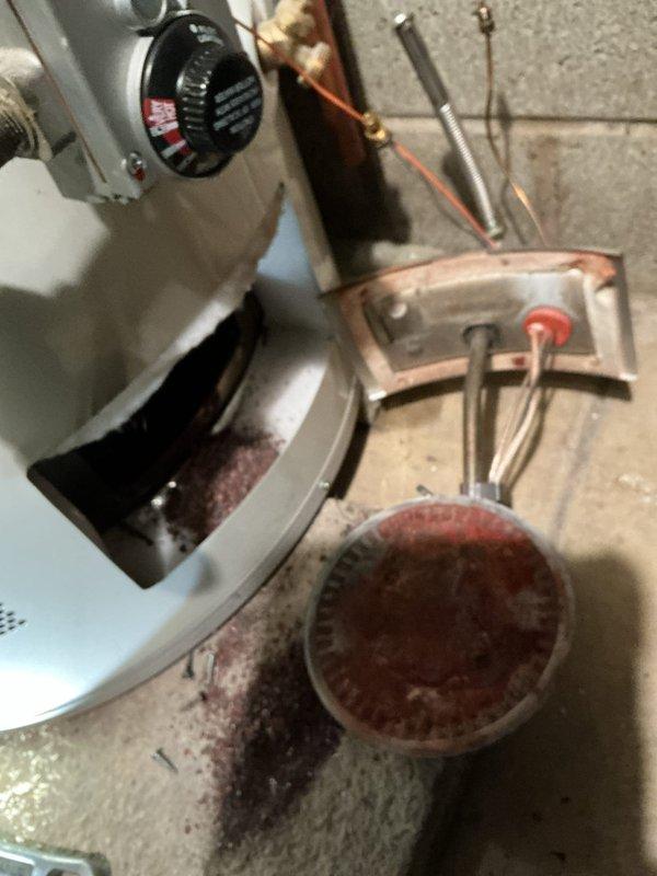Responded to no-ignition issue on 10-year-old tanked water heater. Upon arrival, performed diagnostic evaluation of gas control system and ignition components. Inspected PCB and electrical connections for potential issues related to recent electrical work performed at property. Tested gas valve operation, thermocouple functionality, and pilot assembly. Verified proper gas supply and pressure to unit. Examined burner assembly and flame sensor for carbon buildup or corrosion that could prevent ignition. Checked all wiring connections and control board for signs of electrical damage or loose connections. Documented existing installation configuration including copper supply lines, brass fittings, and exhaust venting. Water heater showed typical wear consistent with age, including surface oxidation on components and minor corrosion on surrounding fixtures. Completed thorough assessment of ignition failure and provided findings regarding potential PCB involvement related to recent electrica