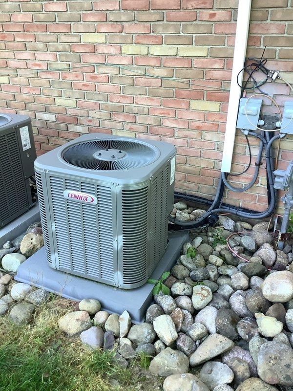 Completed annual air conditioning maintenance on a Lennox outdoor condenser unit over ten years old and accessed the attic-mounted upstairs air handler system. Performed comprehensive inspection of electrical components including capacitor, relay, and control wiring, verified all connections were secure, checked refrigerant levels, cleaned condenser coils, and confirmed proper system operation for both indoor and outdoor units.